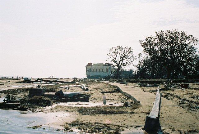 drive_30Aug13.jpg - A view along Hwy 90 looking west from the general area of Jefferson Davis home. The building in the background is the President Casino barge. It broke it's moorings and ended up several hundred yards from it's original locaton.