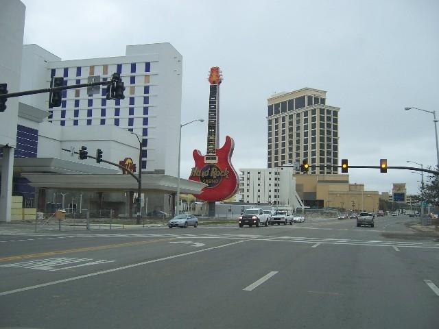 coast_post_katrina_101.JPG - Biloxi - Looking west on Hwy 90, Hard Rock Casino was due to open a few days after Katrina struck. The guitar sign remained, but the casino barge was devastated and the hotel suffered extensive damage. The casino opened June 30, 2007 and hotel shortly afterward.