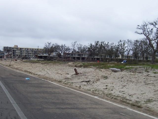 coast_post_katrina_149.JPG - Biloxi - Looking west towards the remains of the Holiday Inn Hotel. The President Casino barge broke from its moorings during Katrina and ened up in the hotel parking lot.