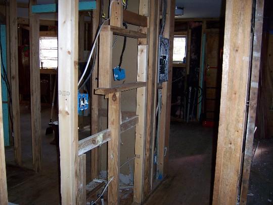 house08.JPG - Down the hallway into the laundry room and back door, another bath was to the left.