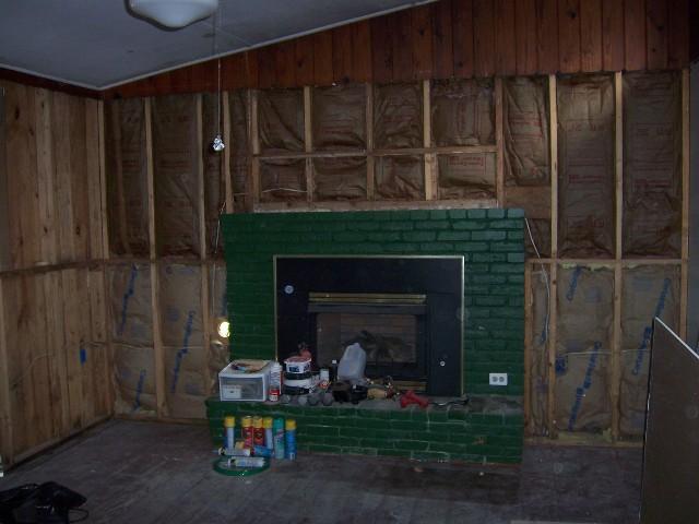 house23.JPG - Living room fireplace after studs had been cleaned and walls re-insulated